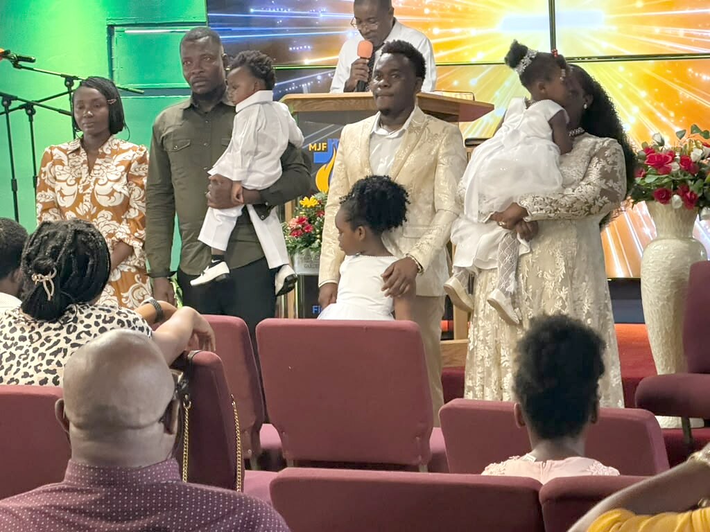 The children and their families before the congregation